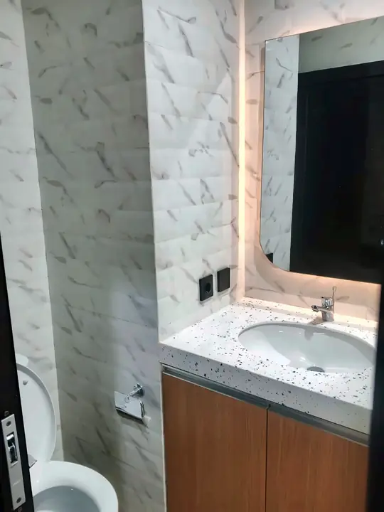 Washbasin with lit mirror